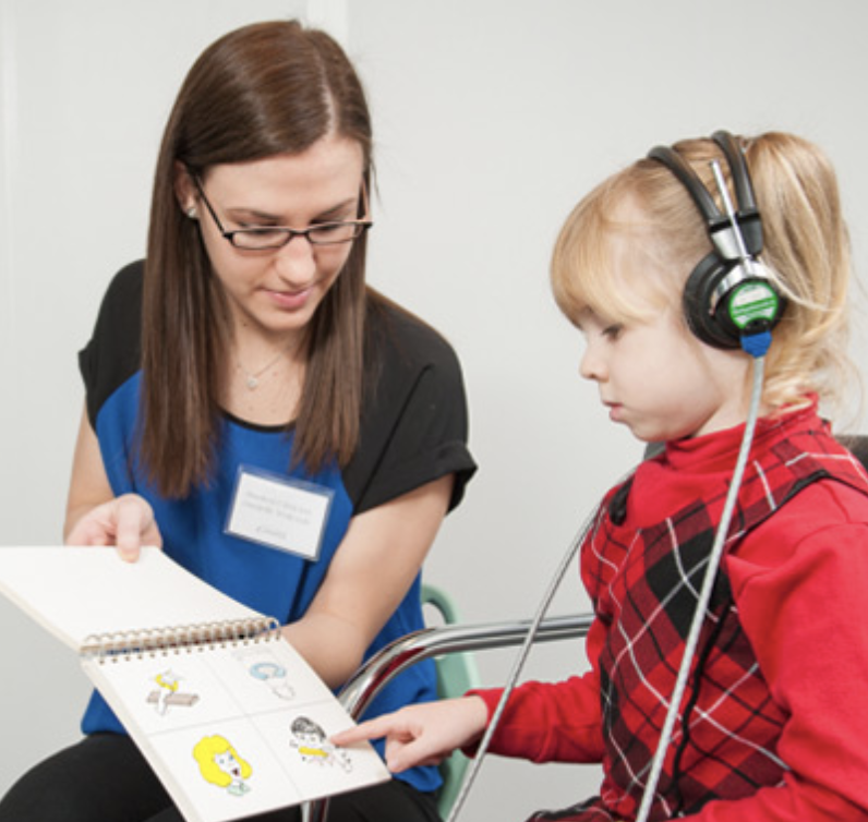 Communication Disorders Sciences student in the on campus clinic with a child