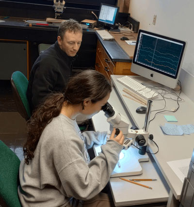 Professor Barclay conducting Research with a student