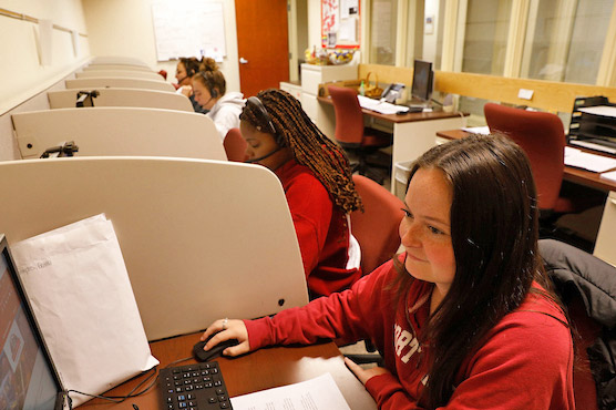 Students working in the call center