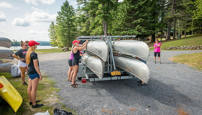 loading canoes on a trailer at Raquette Lake
