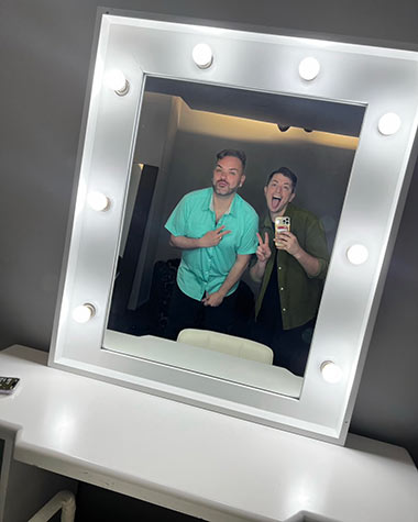 Swenson and Ray in lighted mirror