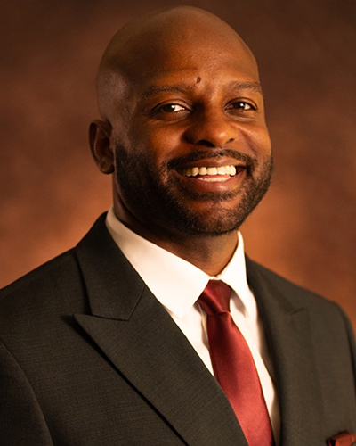Portrait of Ezra Scott in suit and tie
