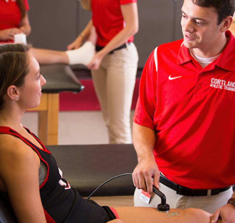 Athletic training student in lab setting