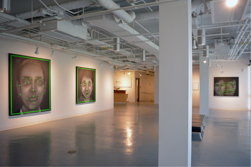 A view into the central gallery featuring three oversized acrylic paintings by the BFA candidate Stephen Buscemi.