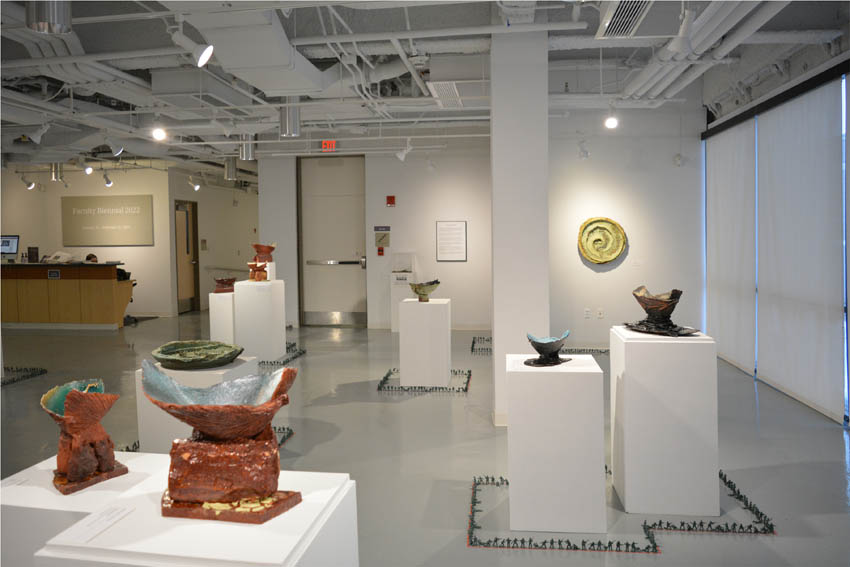 View into the central gallery at Dowd Gallery featuring sculptural objects produced by Jeremiah Donovan, professor of ceramics and floor installation by Bryan Valentine Thomas, instructor of design and drawing, at the Art and Art History Department.