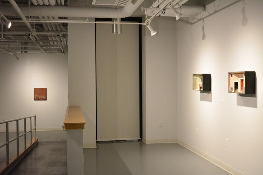 View into the west gallery at Dowd Gallery featuring sculptural objects produced by Buffalo-based sculptor Gary Sczerbaniewicz.