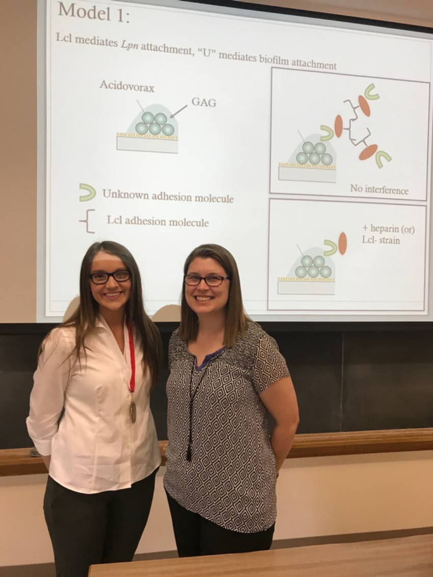 Christa with a student in the classroom