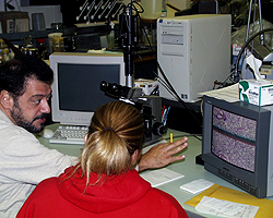 student and mentor at a computer