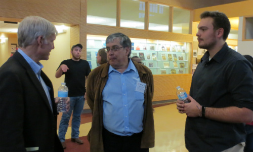 Peter Rakowsky, IST student talking to David Hempson and Peter Castro, two of the panelists Peter Rakowsky, IST student talking to David Hempson and Peter Castro, two of the panelists