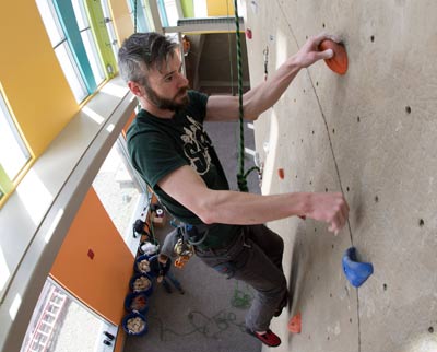 Outdoor recreation major on rack climbing wall in Student Life Center