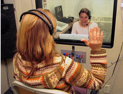 A student and young patient interact in the Speech and Hearing Clinic