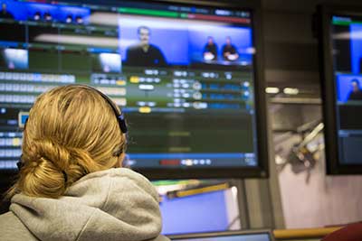 Student working in the campus television station CSTV