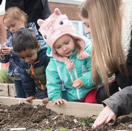 children planting a garden