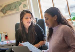 Professor Flavia Dantas provides advisement to a student.